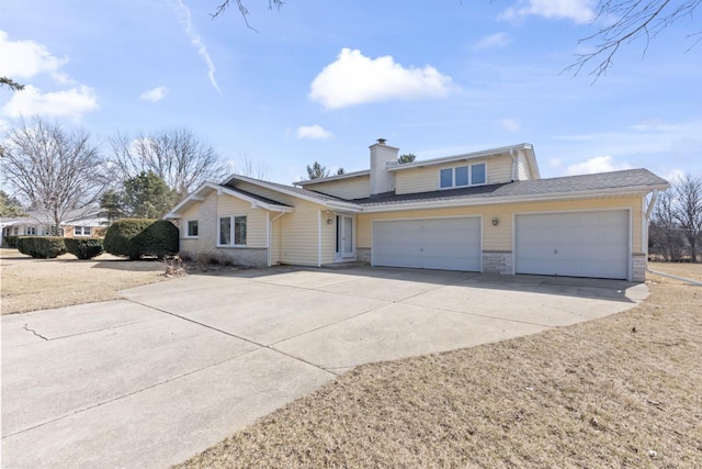 view of front of property with a garage, roof with shingles, concrete driveway, and a chimney