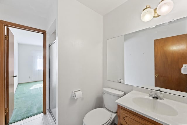 full bath featuring tile patterned flooring, a shower stall, toilet, and vanity