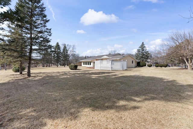 exterior space with a front yard and fence