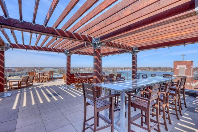 view of patio / terrace with outdoor dining space and a pergola