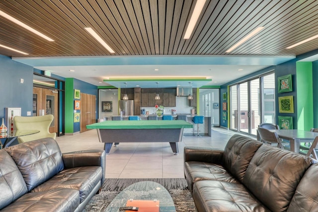 interior space featuring pool table, light tile patterned floors, and wood ceiling