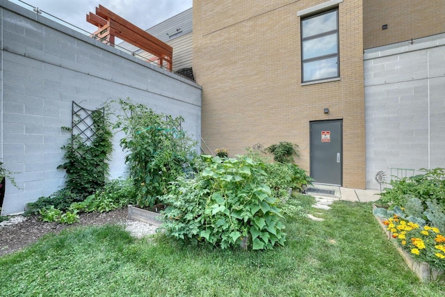 view of exterior entry with brick siding