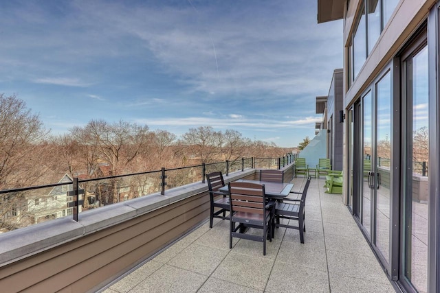 balcony featuring outdoor dining space