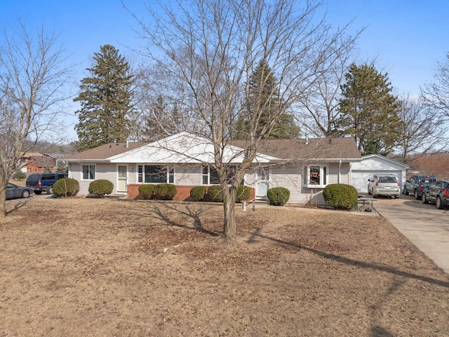 single story home featuring a garage and driveway