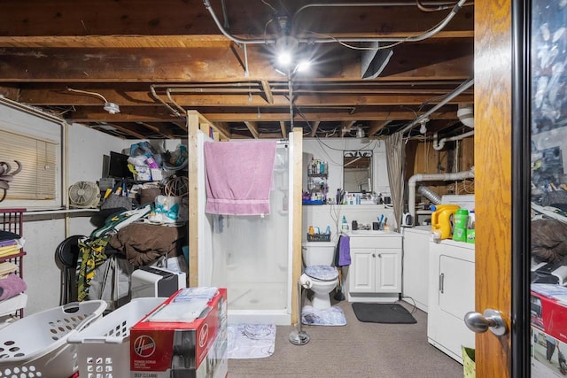 unfinished basement with washing machine and clothes dryer