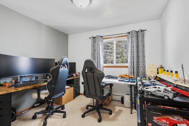 carpeted home office featuring baseboards and baseboard heating