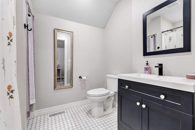 full bath featuring vanity, toilet, baseboards, and visible vents