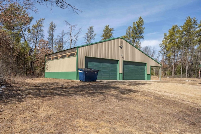 detached garage featuring driveway