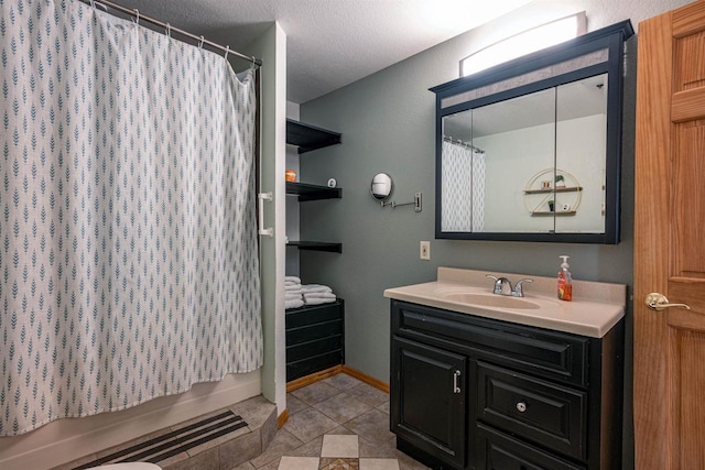 bathroom with tile patterned floors, baseboards, shower / bath combo, and vanity