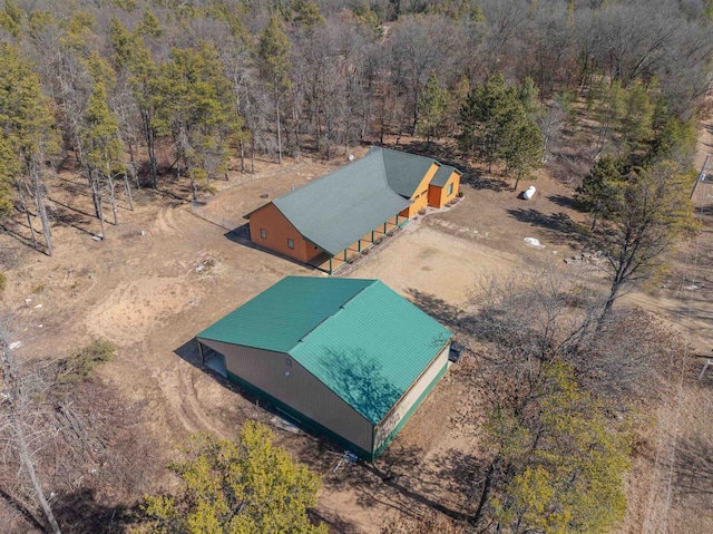 birds eye view of property with a wooded view