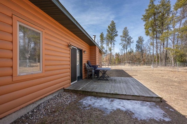 view of patio with a deck and fence