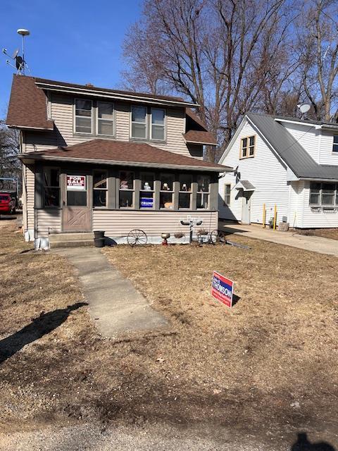 view of front of house with a shingled roof