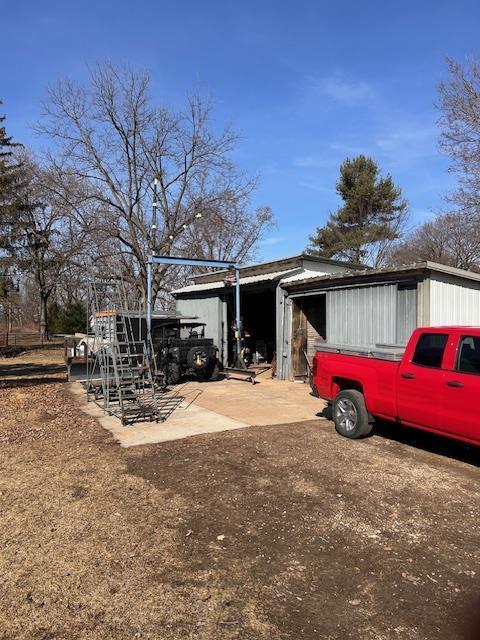 view of home's exterior with an outdoor structure