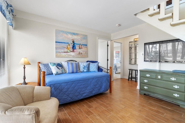 bedroom with wood finished floors