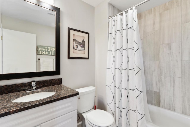 bathroom featuring visible vents, toilet, vanity, and shower / bath combo with shower curtain