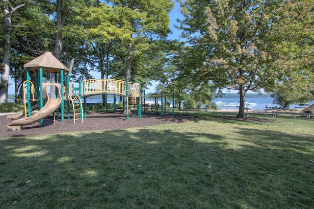 community playground featuring a lawn