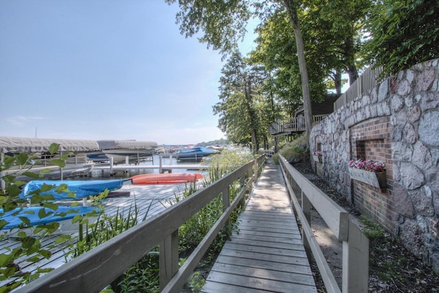 surrounding community featuring a boat dock