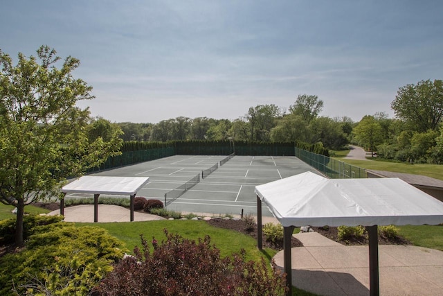 view of tennis court featuring fence