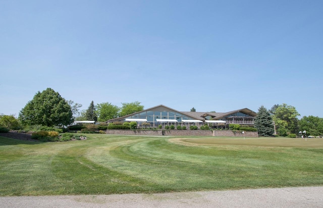 view of home's community with a lawn