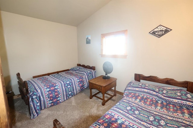 bedroom featuring carpet and lofted ceiling