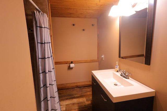 bathroom with wood ceiling, vanity, a shower with curtain, and wood finished floors