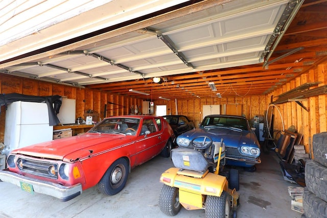 garage with freestanding refrigerator