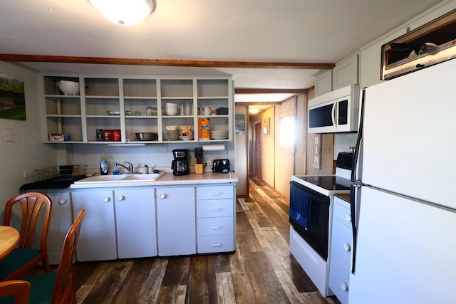 kitchen featuring dark wood-style floors, white appliances, open shelves, and a sink