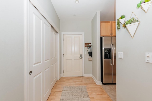 hall with light wood-style floors