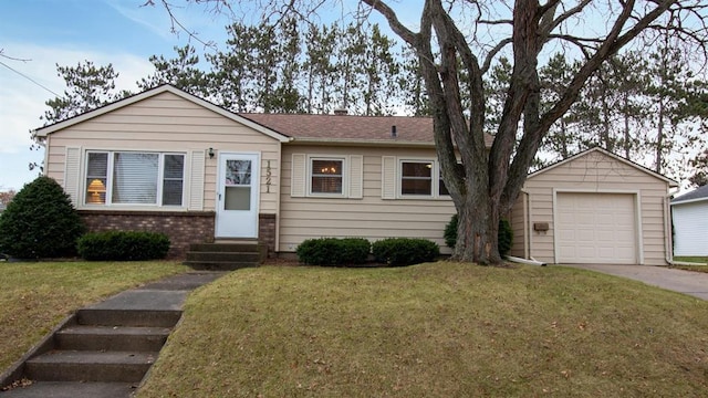 view of front of home with brick siding, entry steps, driveway, and a front lawn