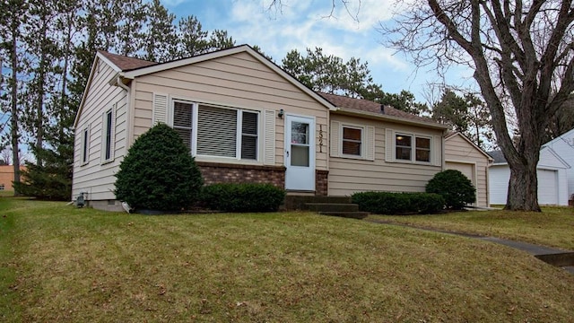 view of front facade featuring a garage and a front lawn