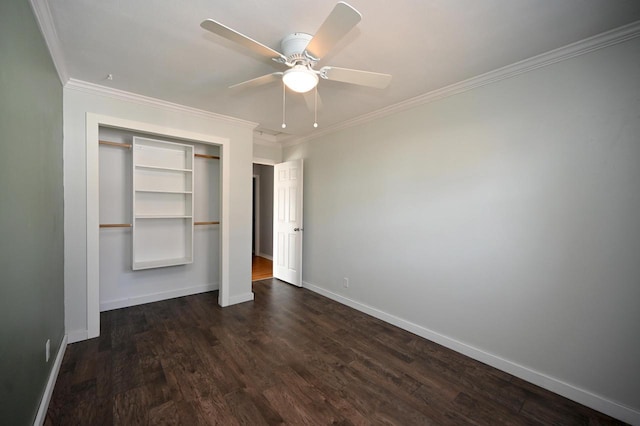 unfurnished bedroom featuring ceiling fan, baseboards, dark wood finished floors, ornamental molding, and a closet