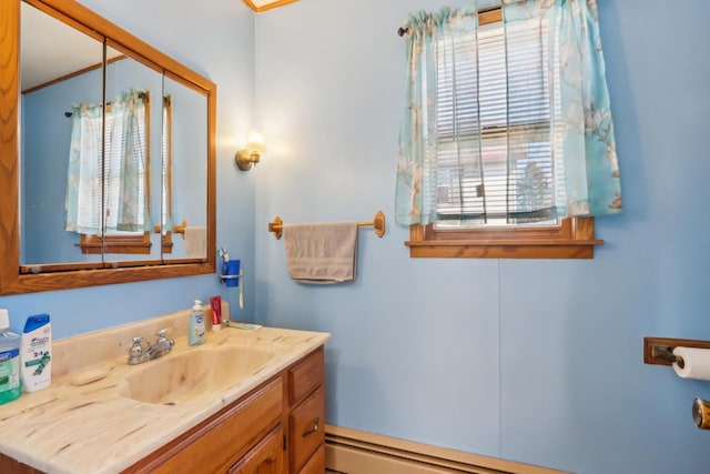 bathroom with vanity and a baseboard heating unit