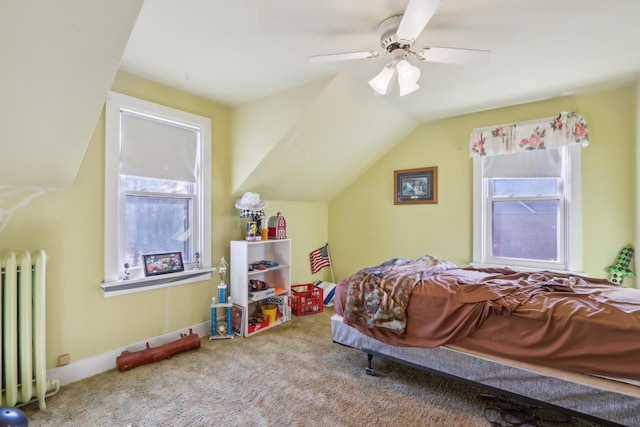 bedroom featuring multiple windows, radiator, lofted ceiling, and carpet flooring