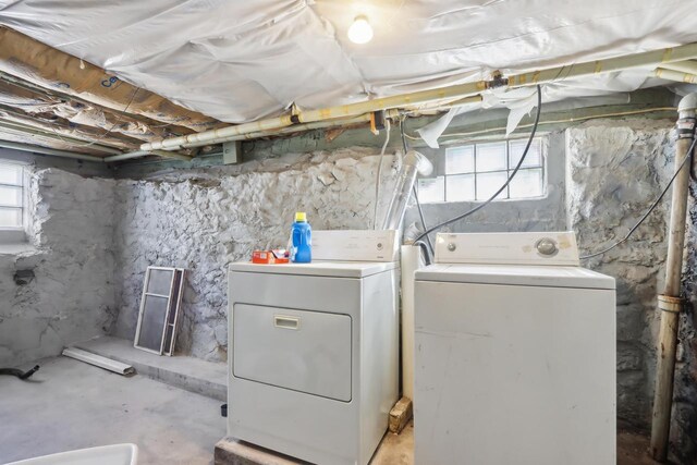 clothes washing area featuring laundry area and independent washer and dryer