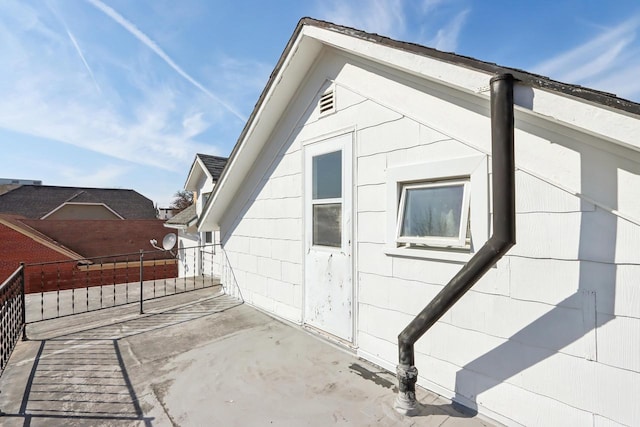 view of home's exterior with fence