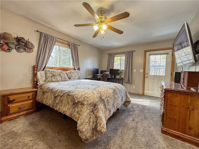 carpeted bedroom with multiple windows and ceiling fan