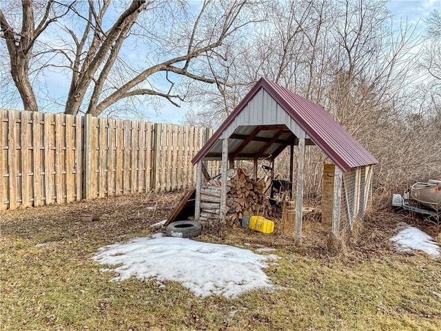 view of outbuilding featuring a fenced backyard