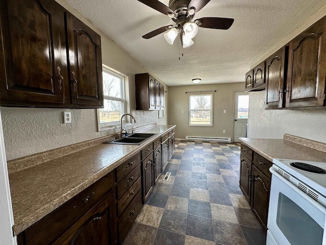 kitchen featuring white range with electric cooktop, plenty of natural light, a sink, dark brown cabinets, and baseboard heating