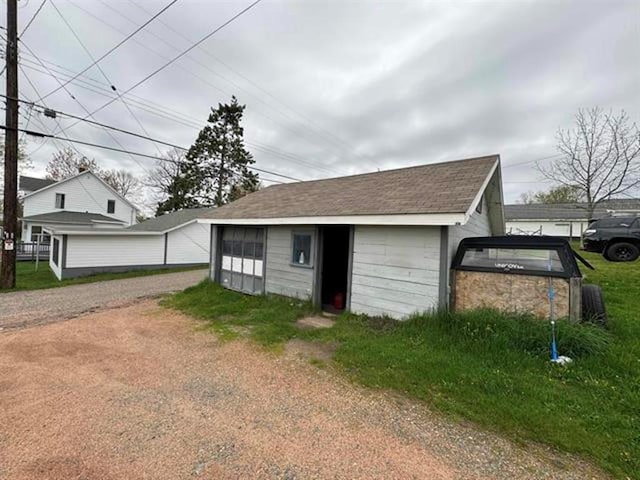 garage featuring driveway