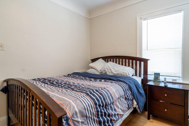 bedroom featuring wood finished floors