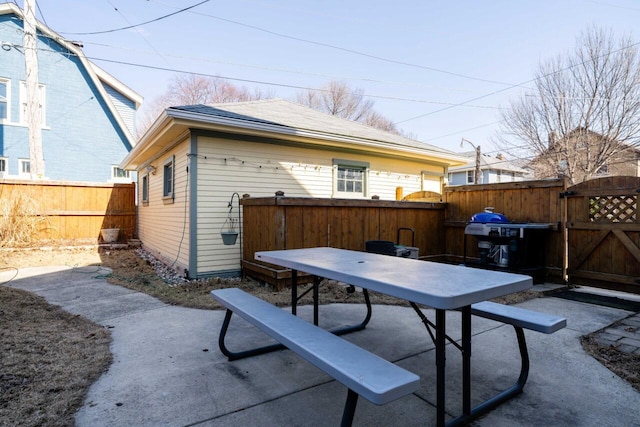 view of patio / terrace with fence private yard, outdoor dining space, and a gate