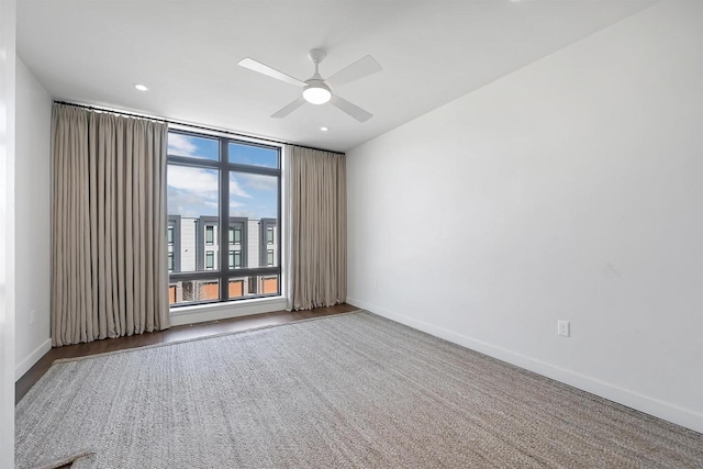 spare room with recessed lighting, baseboards, and ceiling fan