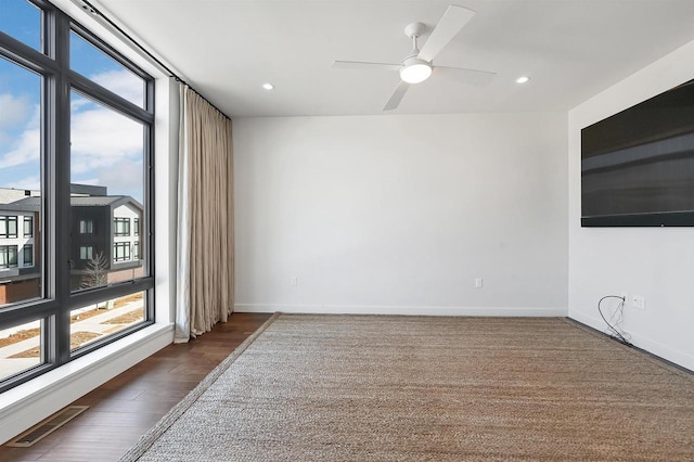 unfurnished room featuring visible vents, wood finished floors, recessed lighting, baseboards, and ceiling fan