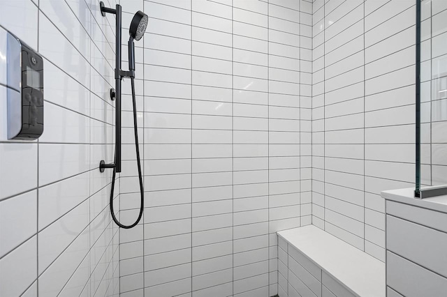 full bathroom with a tile shower