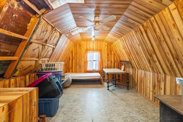 additional living space featuring vaulted ceiling, wooden walls, wood ceiling, and ceiling fan