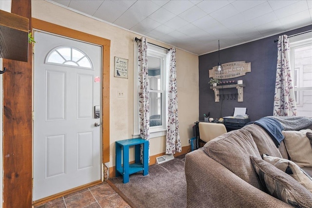 entryway with baseboards and visible vents