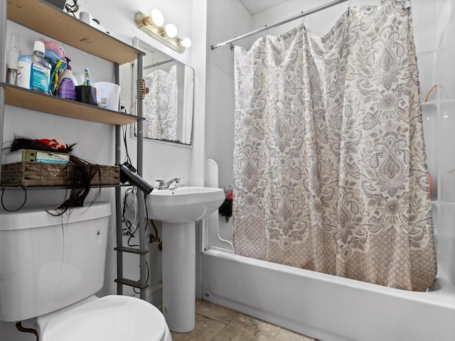 full bathroom with tile patterned flooring, shower / tub combo, and toilet