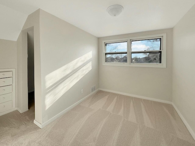 unfurnished room featuring visible vents, baseboards, and carpet floors