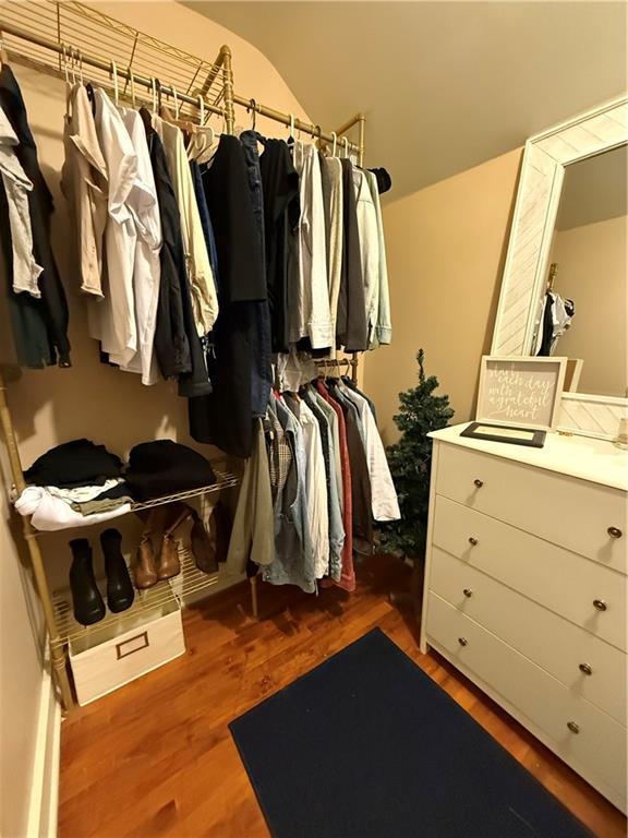 spacious closet with wood finished floors