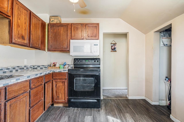 kitchen featuring white microwave, black range with electric cooktop, lofted ceiling, brown cabinets, and dark wood-style flooring